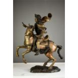 A brass knight on horseback.