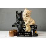 Breweriana: to include; two black and white Scotch Whisky advertising models, a ceramic Scottie dog,