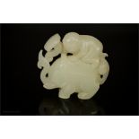 A white jade carving in the form of an elephant, 5cm high.