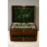 A 19th century rosewood ladies dressing set, brass bound with a fully fitted and silk lined