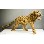 Taxidermi: a model tiger, 42cm long.