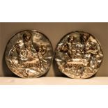 A pair of 19th century silvered copper relief plaques depicting Pan, both inscribed JBte Germain,