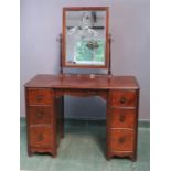 A small 1930s dressing table with mirrored back.