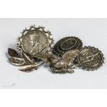 A group of Victorian and other silver brooches, one set with an Indian Rupee, 1.30toz.