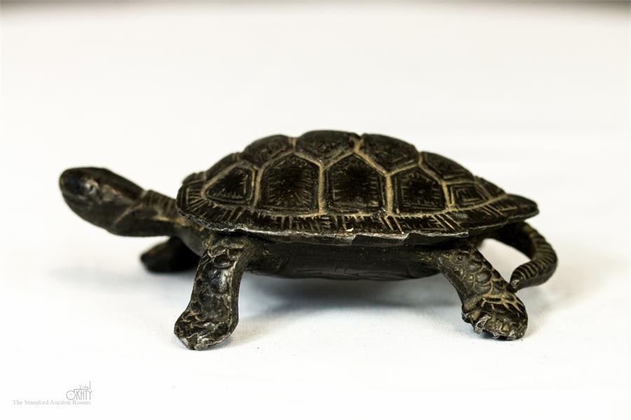 A dark patinated cast metal tortoise. - Image 2 of 3