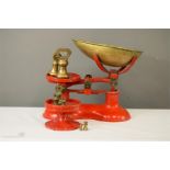 A Bygone set of kitchen scales and brass weights.