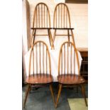 A set of four Ercol style dining chairs.