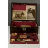 A Victorian rosewood box containing curiosities to include seals, miniature horse shoe, brass medal,