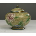 A Cloisonne jar and cover depicting peonies.