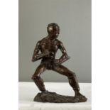 A Chinese bronze figure of a martial artist.