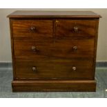 A small Victorian mahogany chest of drawers, with two short over two long graduated drawers .