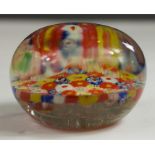 A millefiori glass paperweight.