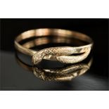 A 9ct gold bracelet in the form of twin head snake with four diamonds set to the head, pink