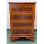 A mahogany cabinet with dummy drawers to the door.