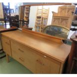 A teak retro dressing table with rectangular mirrored back.