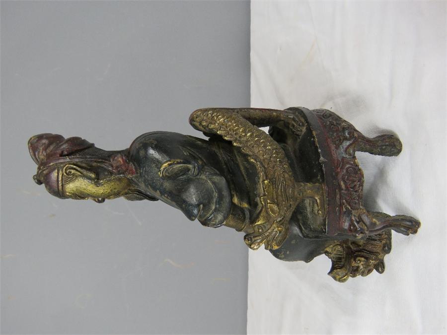 A Chinese bronzed figure of a seated man, bearing residual gilding. - Image 2 of 5