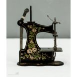 A 19th century German metal painted sewing machine no.463304.