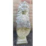 A garden stone lion holding shield.