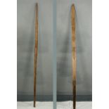 Two treen ethnic paddles.