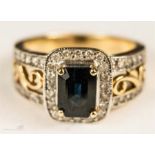 An 18ct gold sapphire and diamond ring, size O/P, 7.7g.