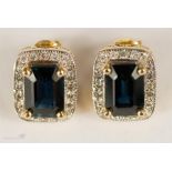 An 18ct gold sapphire and diamond pair of earrings, 5g total.