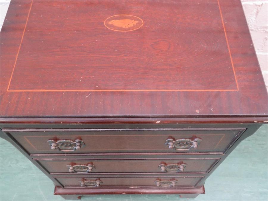 A mahogany chest of drawers.