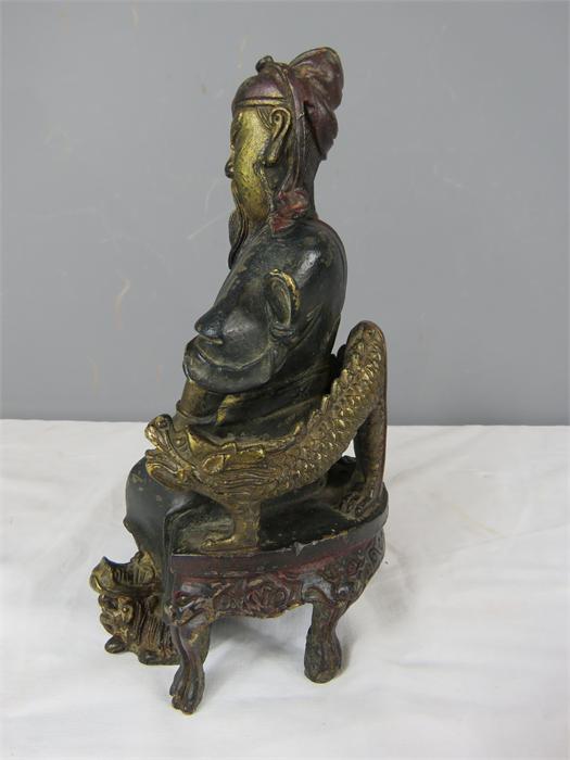 A Chinese bronzed figure of a seated man, bearing residual gilding. - Image 5 of 5