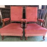 A pair of early 20th century pink velvet upholstered armchairs.