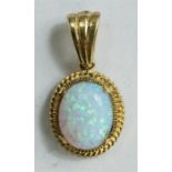 A 9ct gold and opal pendant, 1.8g total.