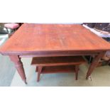 A Victorian mahogany extending dining table, with two extra leaves, raised on turned legs.