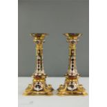 A pair of Royal Crown Derby Old Imari gold band candlesticks, 1128, 26cm high.