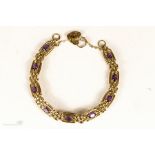 A 9ct gold and amethyst bracelet, 15.1g.