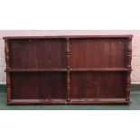 An 18th century oak wall plate rack with baluster turned supports.