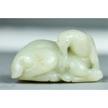 A Chinese jade carving of a goat.