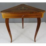 A marquetry top music/sewing table.