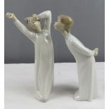 A pair of Lladro figures.