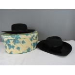 A Mitzi Lorenz of London black hat and a Just Natural black hat with hat box.