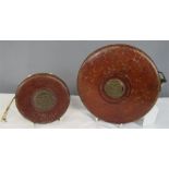 Two leather bound tape measures: Chesterman of Sheffield, 50ft and John Rabone & Sons of