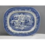 A blue and white 19th century willow pattern meat plate.