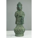 A Chinese cast metal figure of Guanyin.