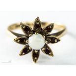 A 9ct gold, opal and garnet flower-head ring, size K/L, 2.5g