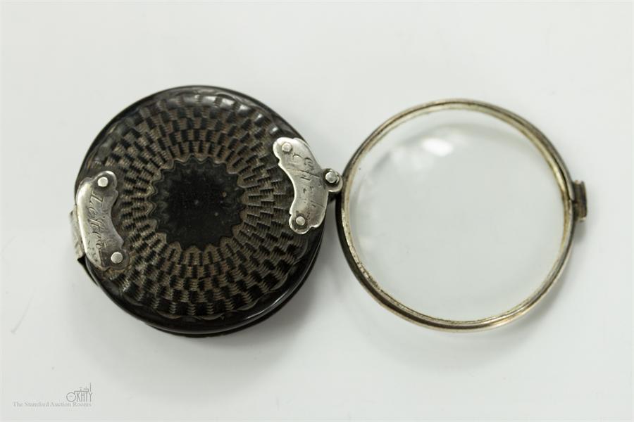 A late 18th century engraved horn reading glass, silver frame and mounts, engraved Elizabeth Letter,