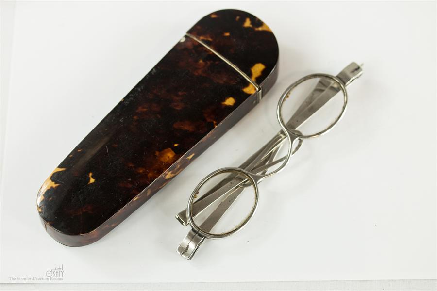 A 19th century tortoiseshell spectacles flip top case with silver plaque engraved with the