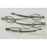 Four late 18th/early 19th century silver half spectacles, two marked London. A/F