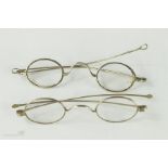 Two pairs of early 19th century silver spectacles.