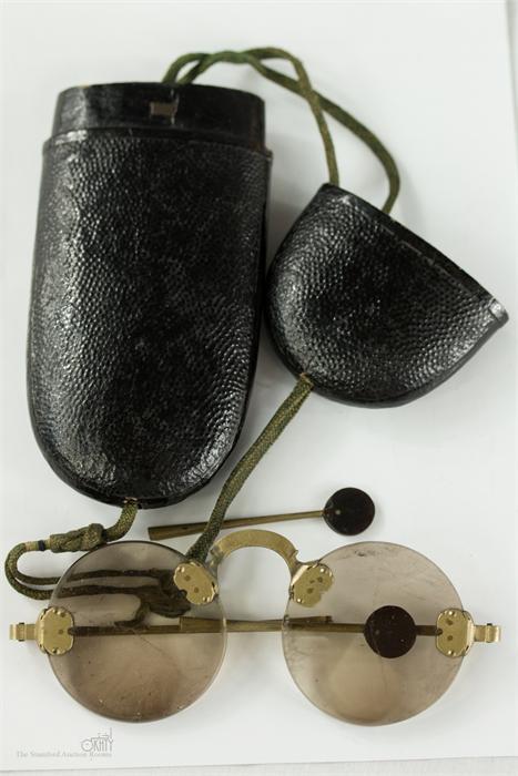 A pair of 19th century brass Chinese sunglasses, quartz lenses, rimless, curved bridge, together