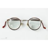 A pair of 20th century tortoiseshell French spectacles.