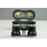 A pair of Negretti & Zambra opera glasses in the original labelled case.