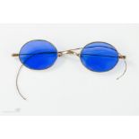 A pair of gilt metal blue lens sunglasses.