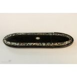 A 19th century black lacquered papier mache frogmouth spectacles case inlaid with mother of pearl,